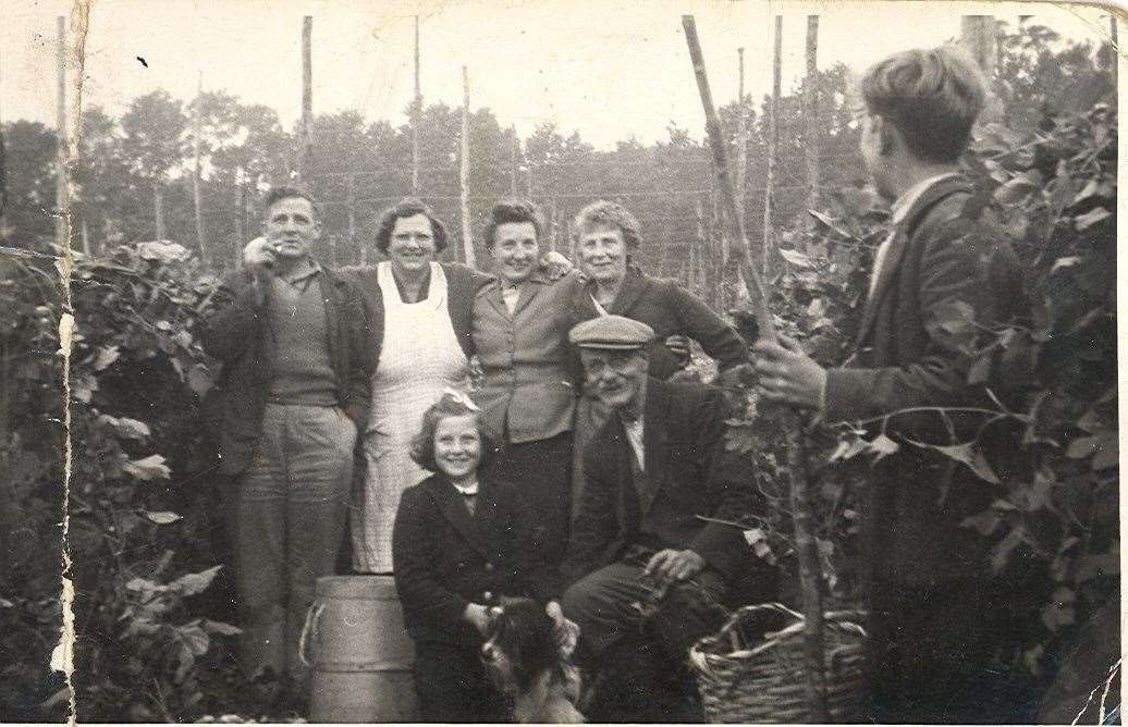 A scene from the Kent hopfields in 1957, including George and Sylvia Hadley from Dover. Picture: Bill Richards