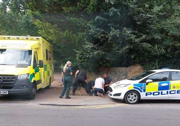 Police holding the driver to the ground in Church Street. Pictures: Richie Heron