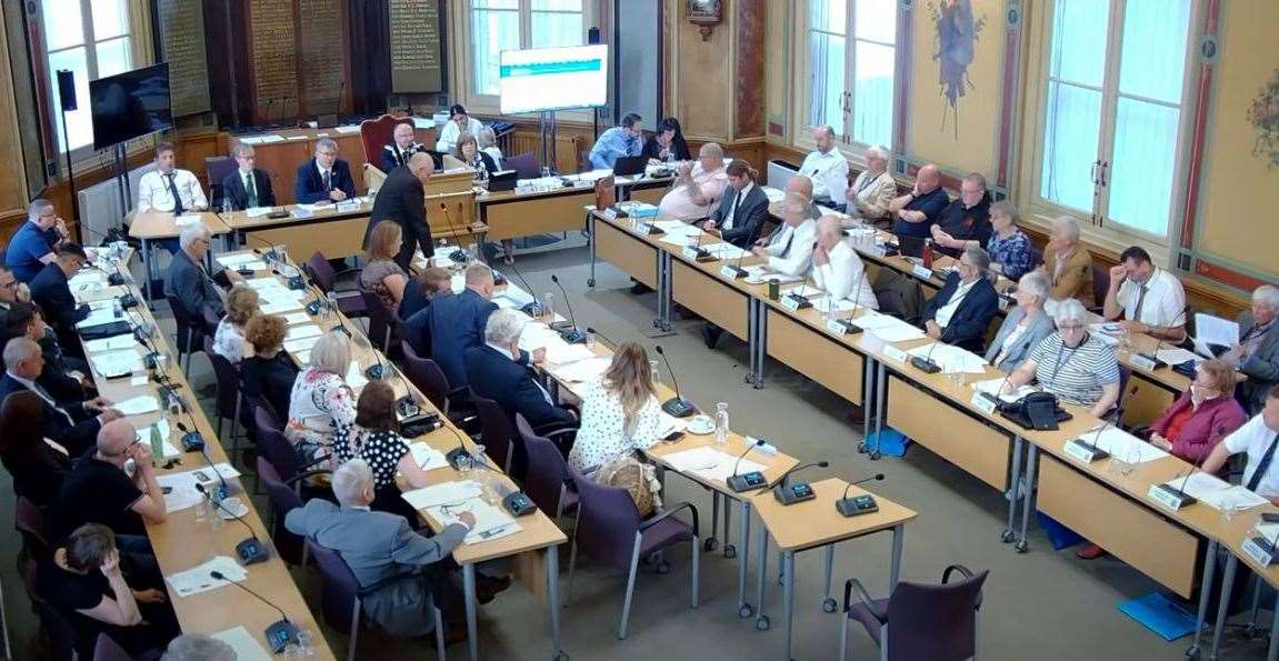 The council meeting in the Town Hall