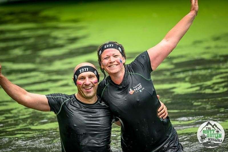 Runners celebrate in the pond