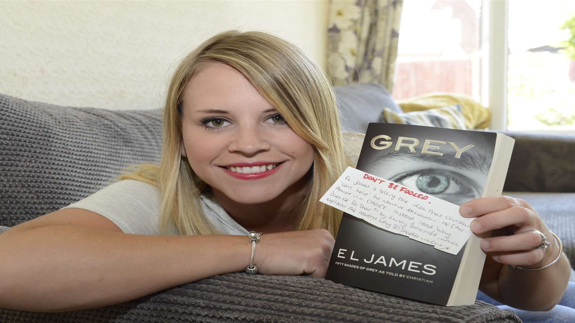 Chloe Darling with the note she found in her Fifty Shades of Grey Book