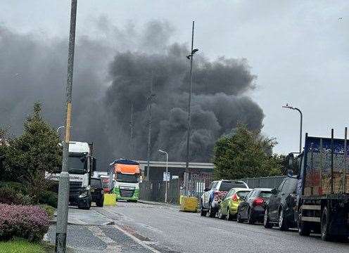 The fire created a huge smoke cloud over the industrial estate. Picture: Callum Parsons
