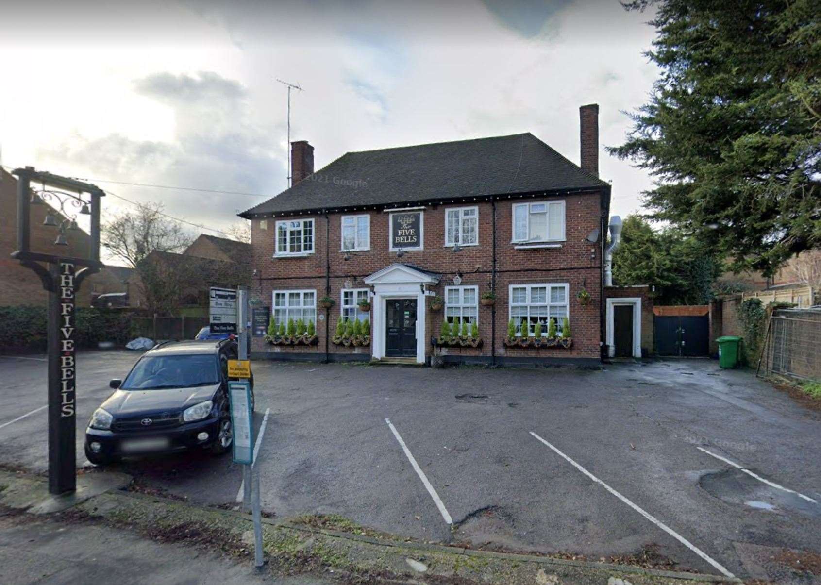 A fallen power cable and tree outside The Five Bells pub in Halling caused staff to be trapped. Picture: Google