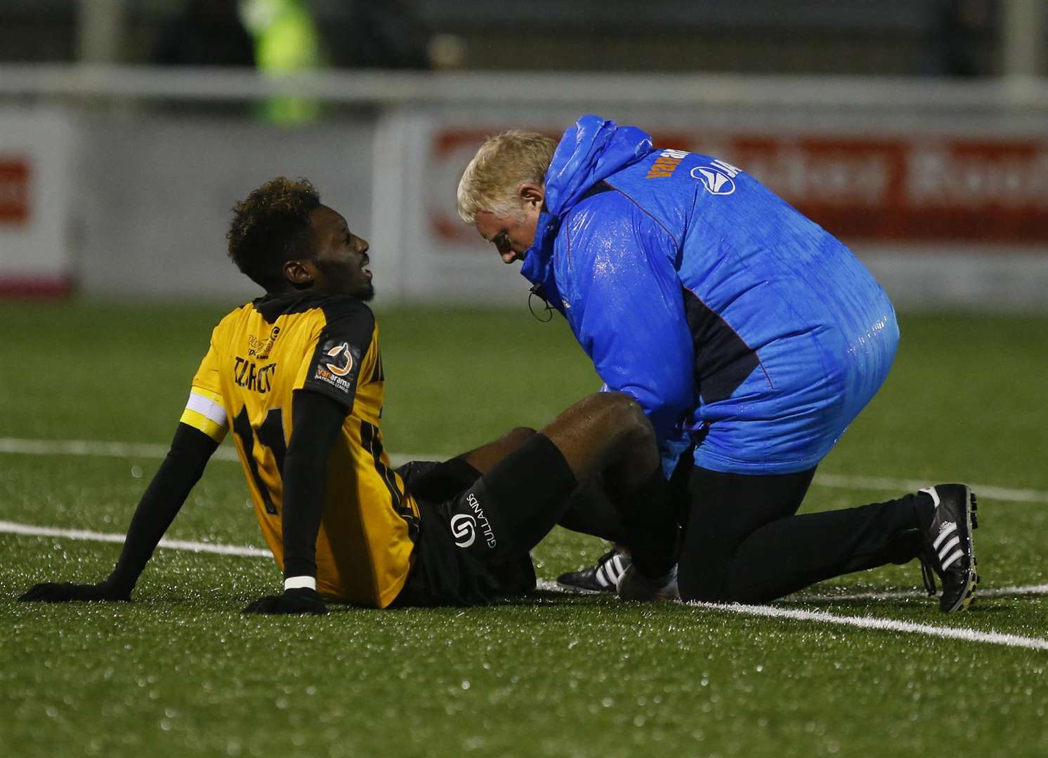 Maidstone captain Blair Turgott receives treatment from physio Paul Smith Picture: Andy Jones