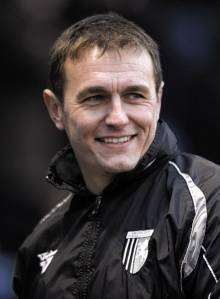 Assistant manager Ian Hendon is all smiles after another Gillingham win