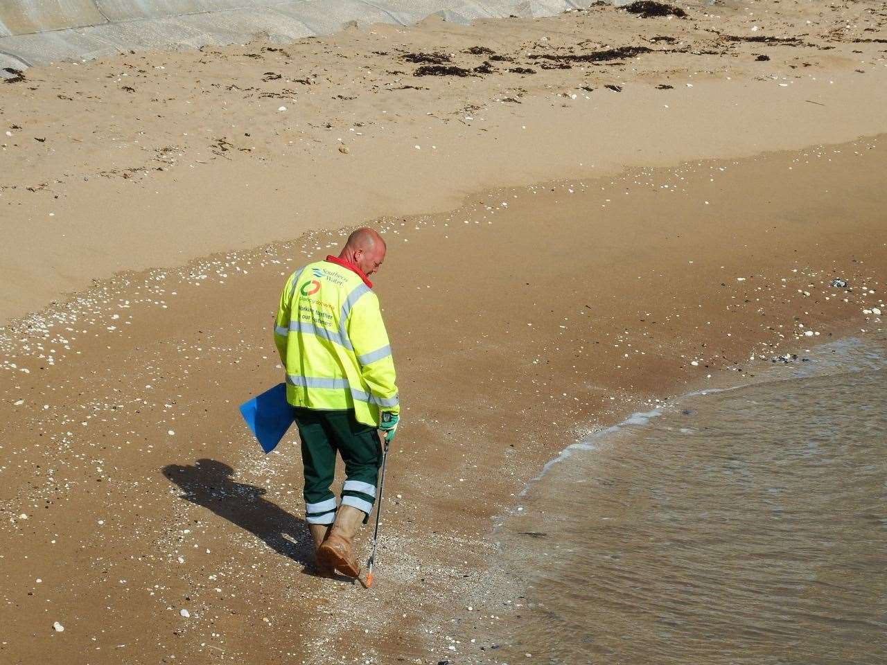 Litter-pickers on Thanet beaches that were closed to swimming after sewage was pumped into the water in an emergency discharge. Picture: Mike Pett