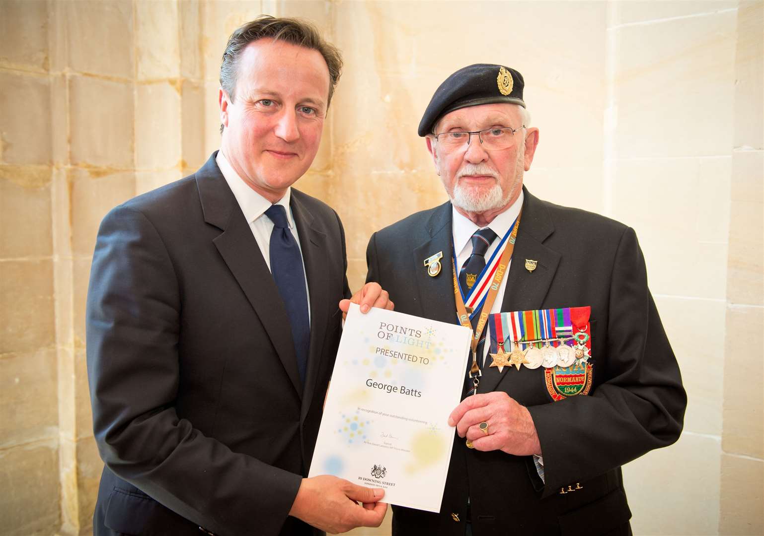 George Batts was honoured with a Point of Light Award by Prime Minister David Cameron in recognition of his voluntary work with D-Day veterans