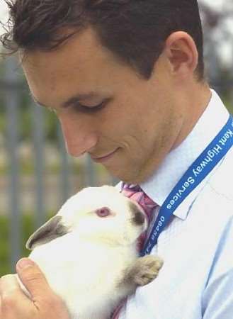 Simon Greenhalgh with the rabbit he rescued. Picture: PHIL HOUGHTON