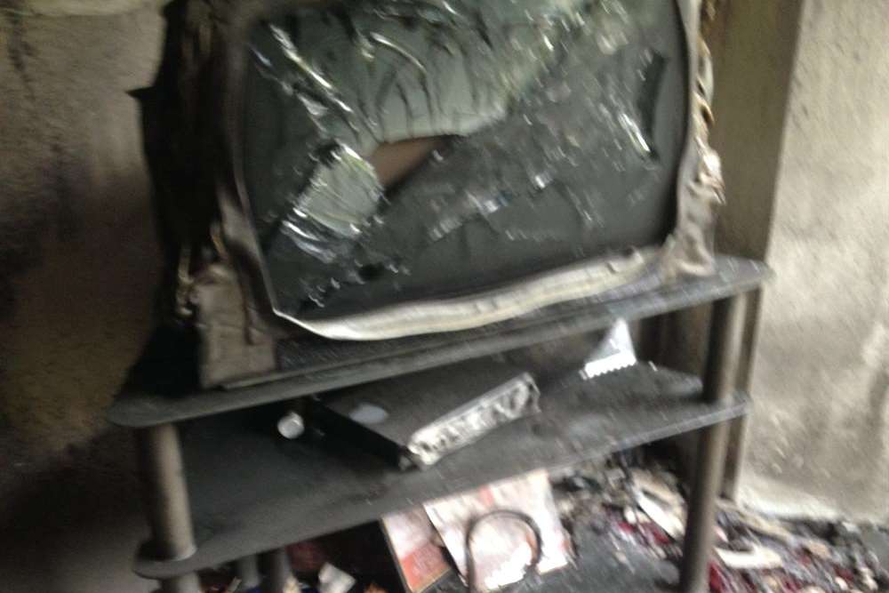 A TV was among the items badly damaged in a tealight blaze in Chatham Hill