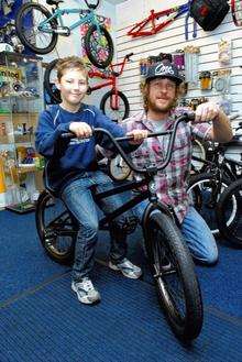 Ten year old Lewis Ralph takes delivery of his eastern crawler bike from Rich Stevens, owner of Vandal Bikes in Sheerness High Street