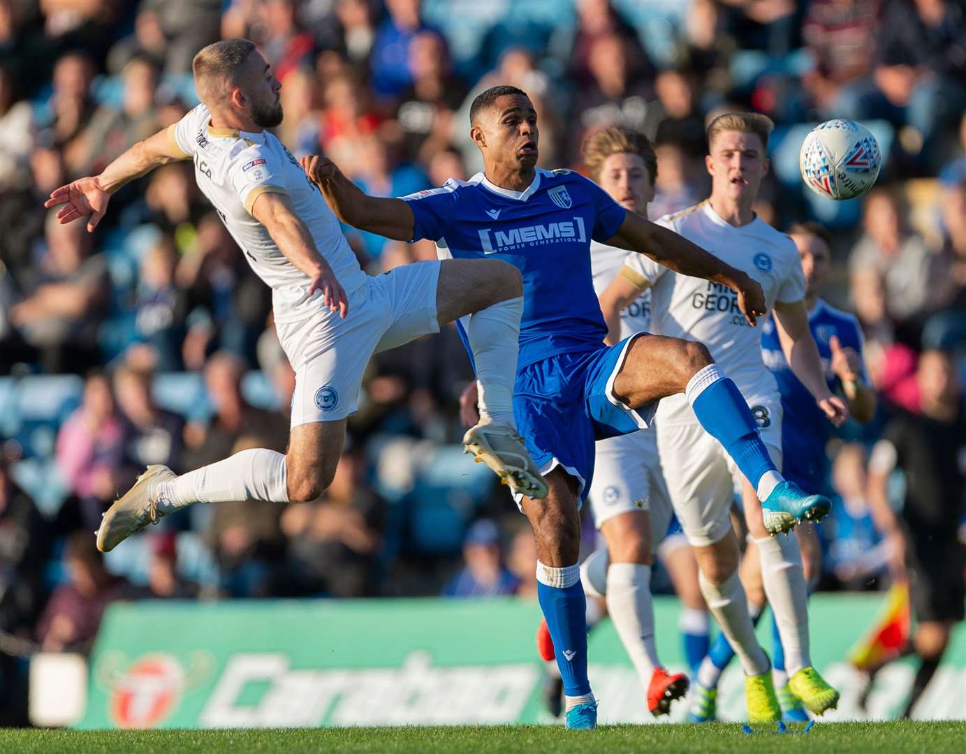 Gillingham's Mikael Mandron is challenged by Dan Butler. Picture: Ady Kerry
