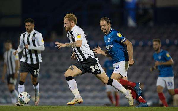Gillingham’s Connor Ogilvie in action against Portsmouth in the Checkatrade Trophy. He should be fit again this weekend. Picture: Ady Kerry