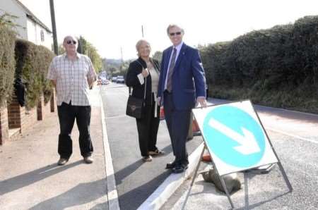 Parish councillors Mick Giles and Viv Spratt and county councillor Michael Northey with one of the newly built traffic calming kerbs. Picture: Gerry Whittaker