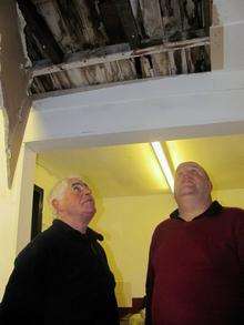 Joe Brownett and Andy Short assess the damage at Whitstable Town FC after metal thieves struck the club