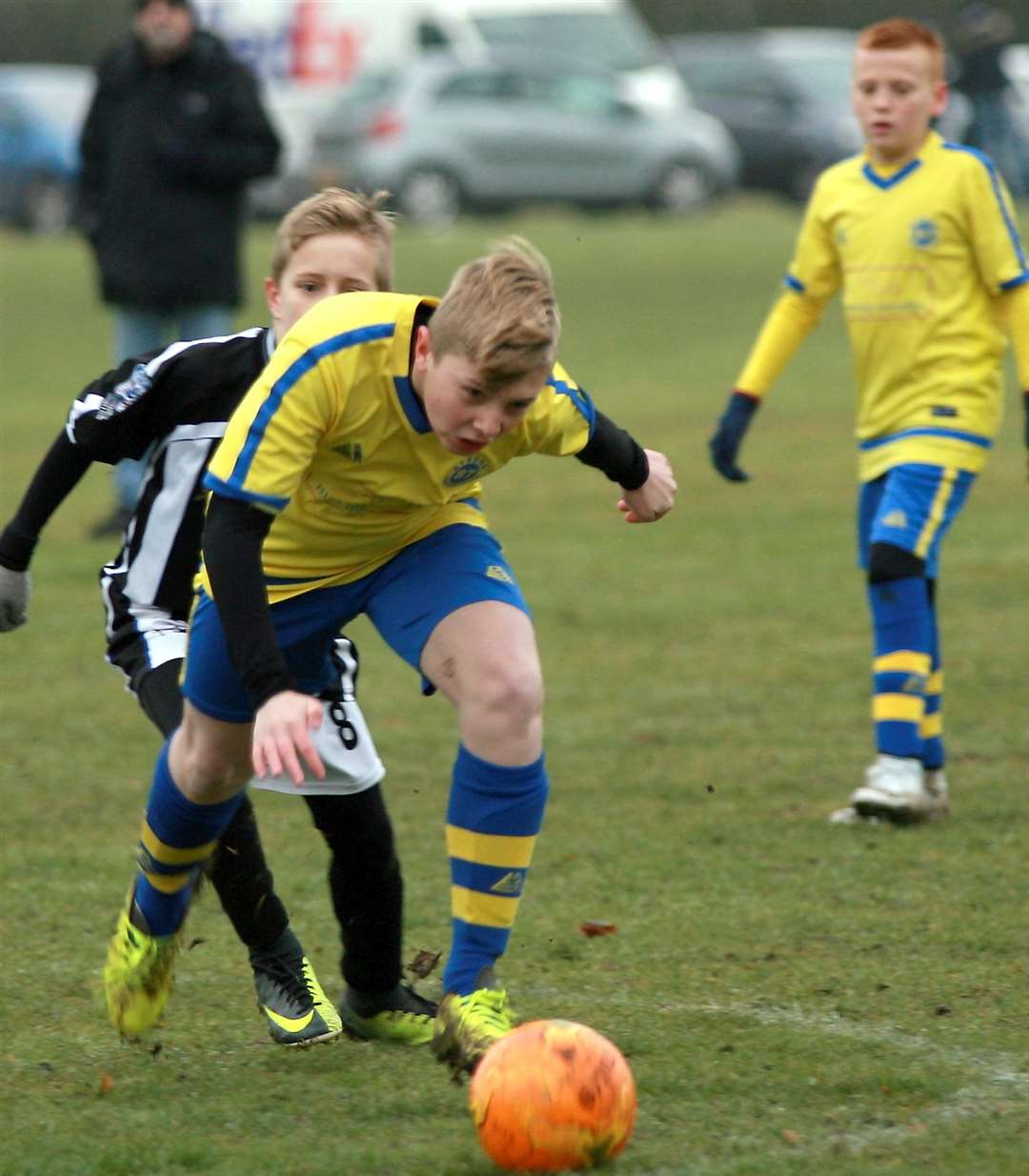 Strood 87 (yellow) and Milton & Fulston United battle for victory in Under-12 Division 2 Picture: Phil Lee