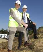 Professor Sir David Melville turns over the first turf