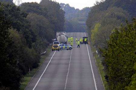 Accident investigation teams at the site of the fatal crash on the A2070