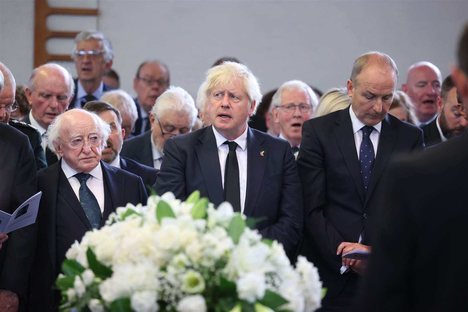 Prime Minister Boris Johnson, Irish President Michael D Higgins and Taoiseach Micheal Martin at the funeral of Lord Trimble (Liam McBurney/PA)
