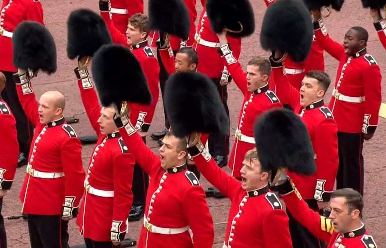 The King's Guard raised their bearskin caps above the head after the Garter King of Arms declared "three cheers for His Majesty the King" yesterday. Picture: BBC