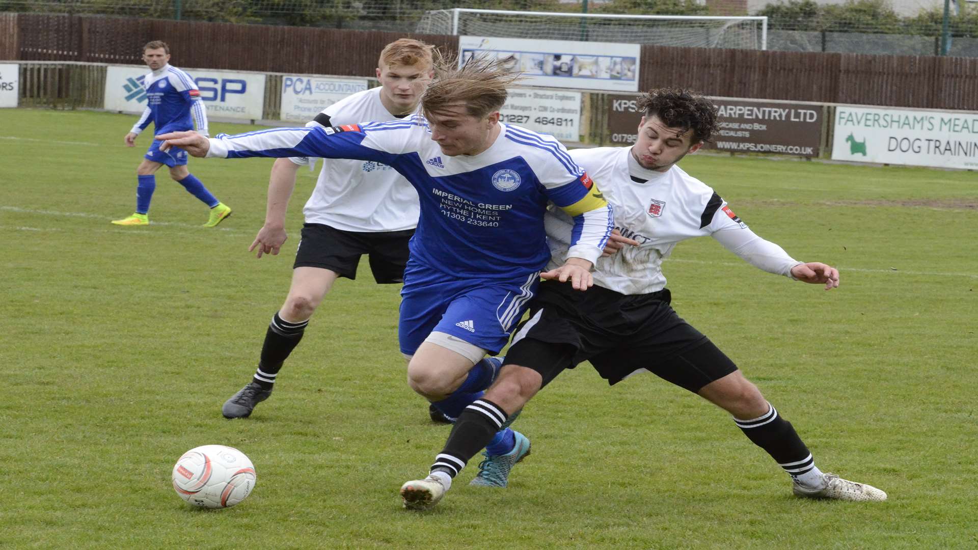 James Morrish battles for possession during Hythe's defeat at Faversham Picture: Chris Davey