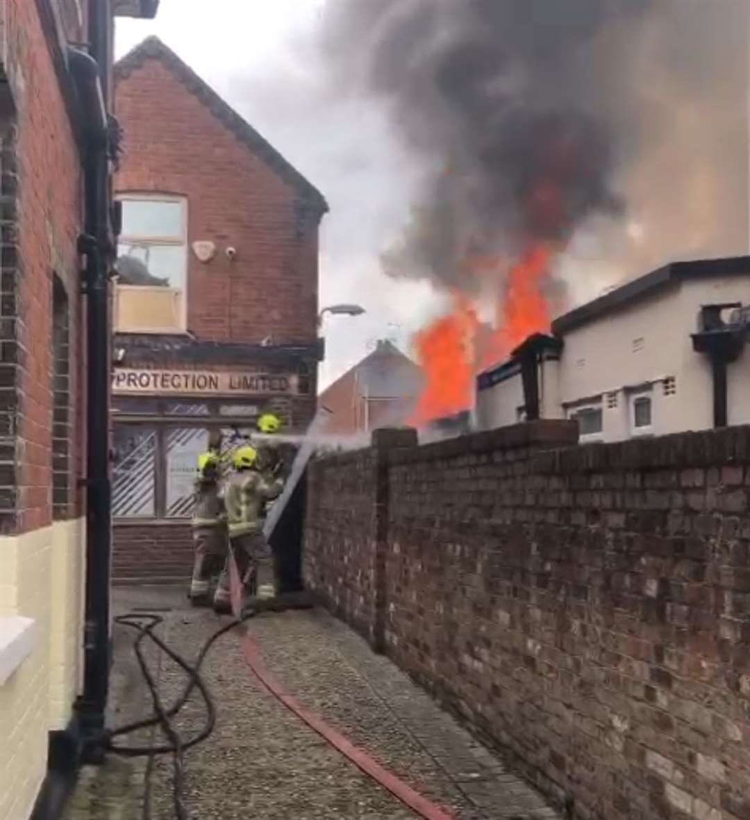 Firefighters battling the blaze. Picture: Geoff Montague-Smith.