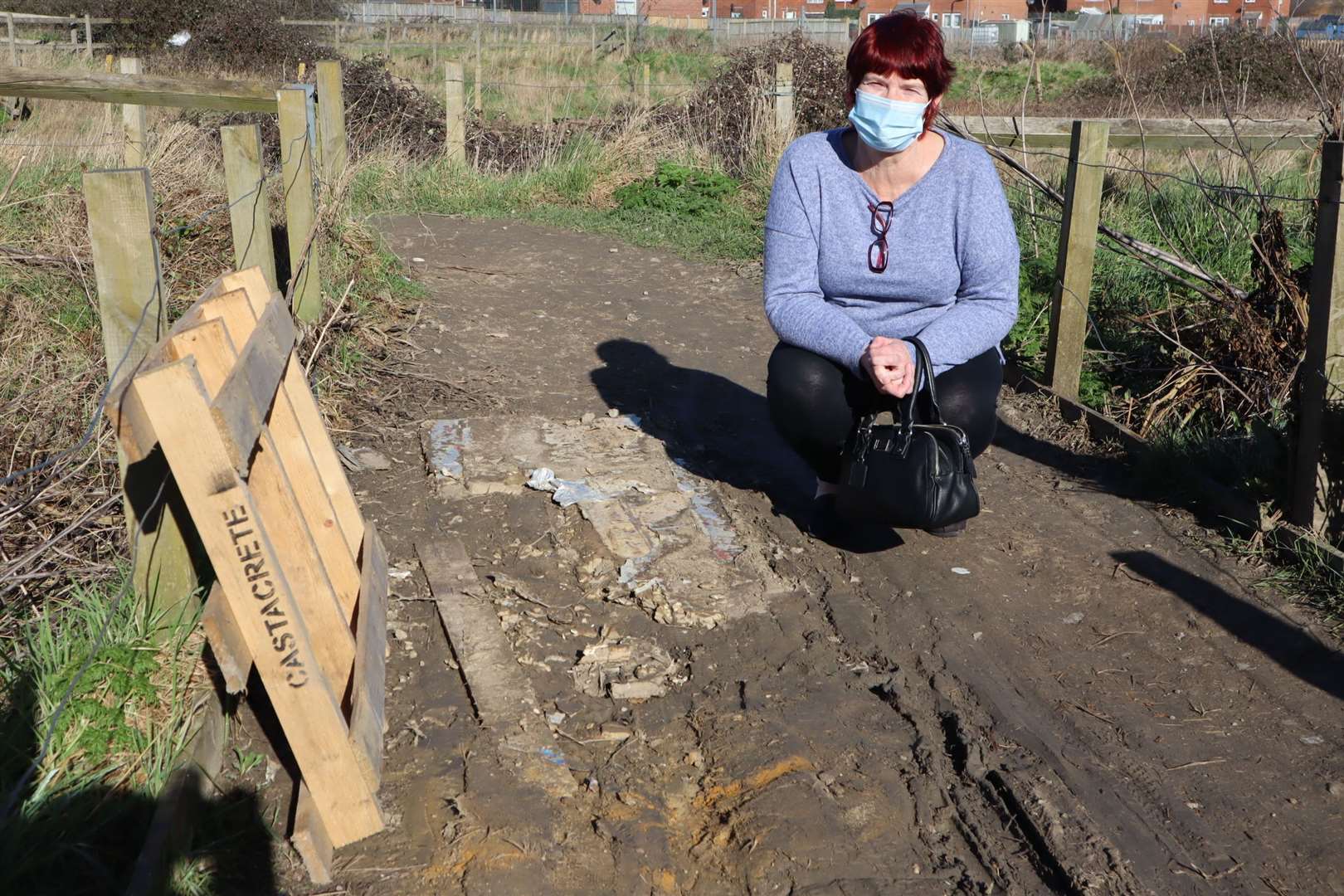 Shirley Young at the muddy track at Neats Court retail park, Queenborough, which becomes impassable after rain. It is section C on the map