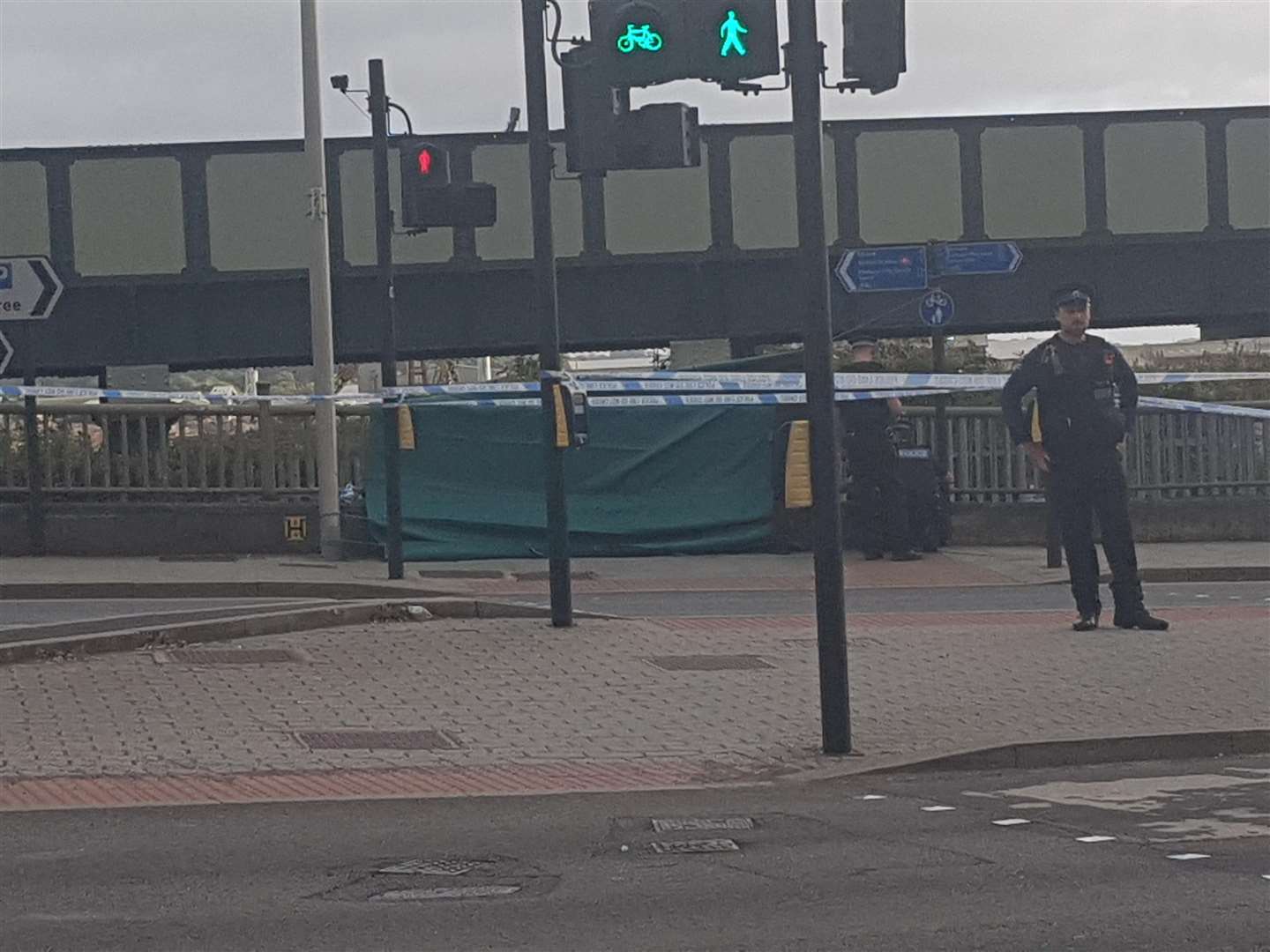 A green tarpaulin has been put up around the scene at Rochester Bridge