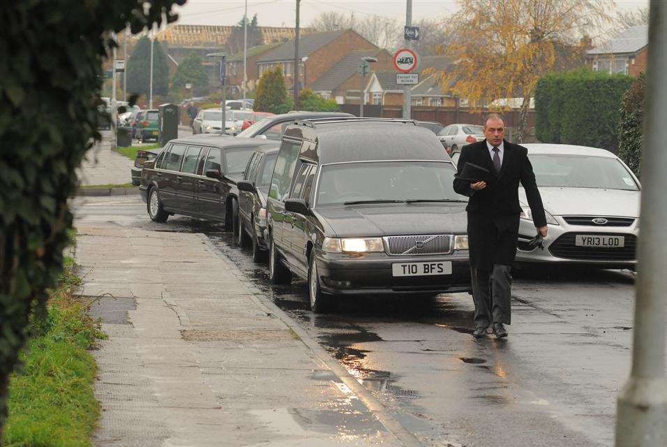 The funeral cortege arrives at Holy Trinity Church