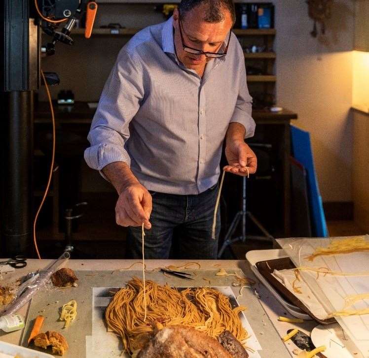 Food artist Carl Warner working on his creation