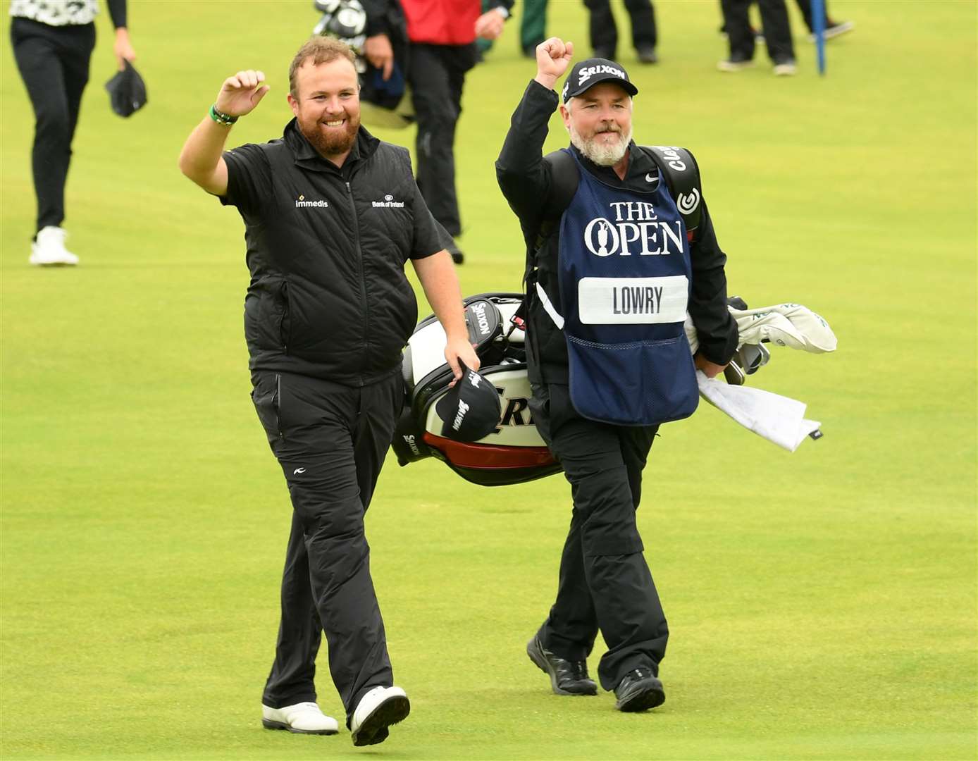 Shane Lowry and his caddie Bo Martin acknowledge the crowd as they approach the 18th green during the final round of the 148th Open in 2019. Picture: The R&A