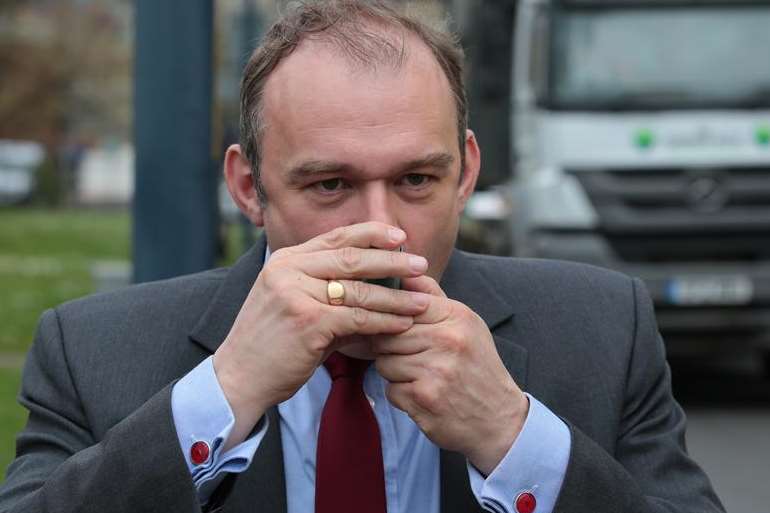 Climate change secretary Ed Davey uses an inhaler on a visit to Upper Stone Street in Maidstone. Picture: Martin Apps