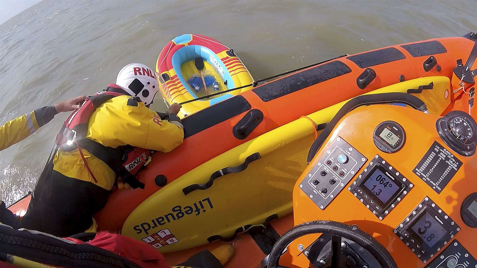 Sea rescue: RNLI crew from Whitstable retrieve inflatable toy after rescuing man and lifeguard off Leysdown, Sheppey. Picture: RNLI Whitstable