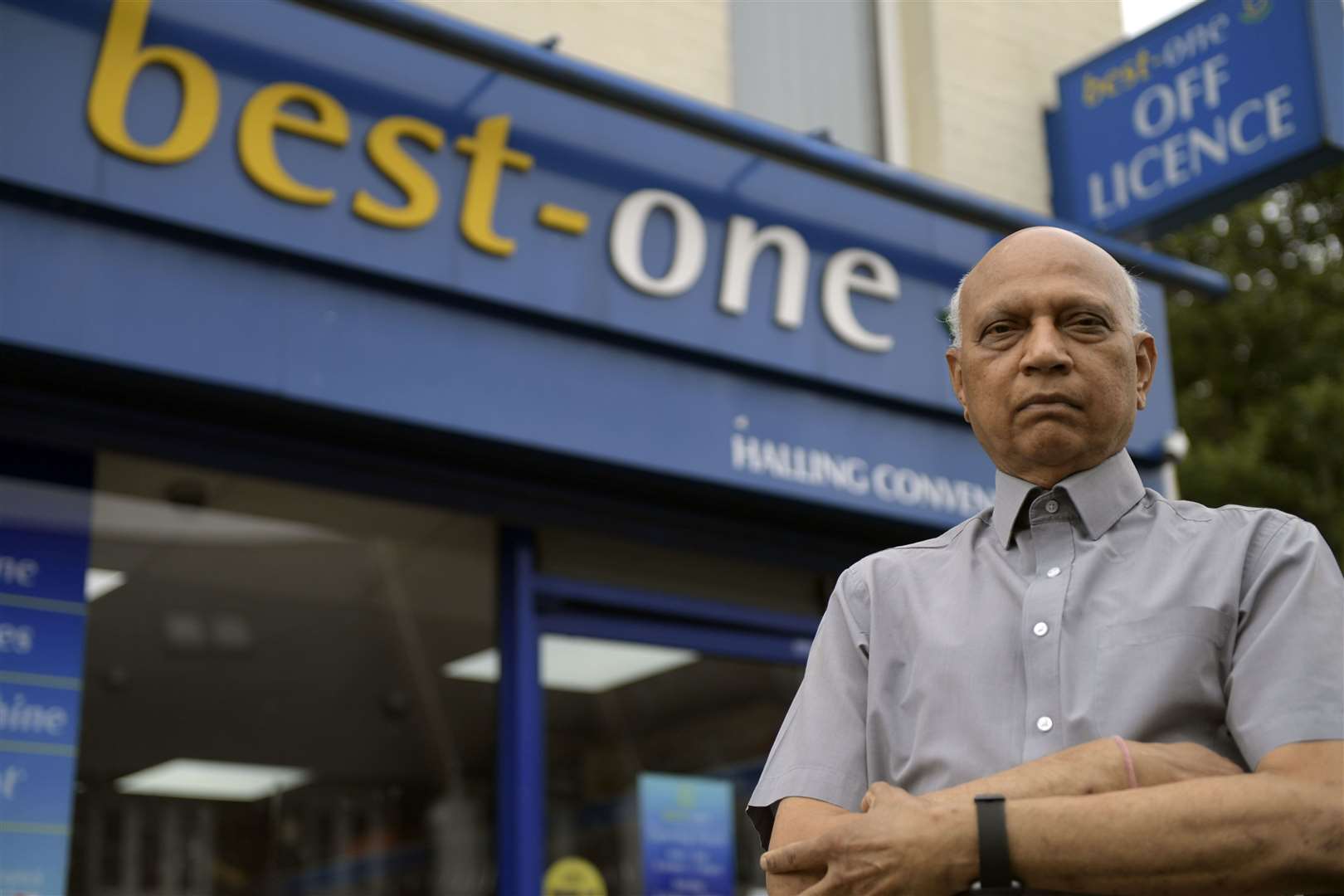 Vinay Patel outside his shop, Best One off licence