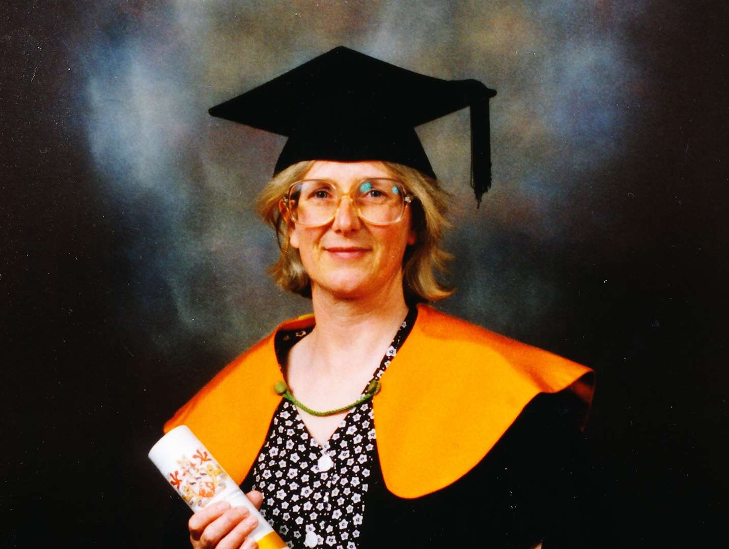 Faith Chantler pictured with her master's degree in English