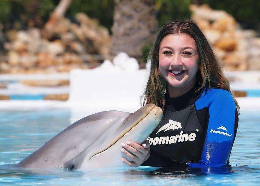 Yasmin swimming with dolphins in Portugal