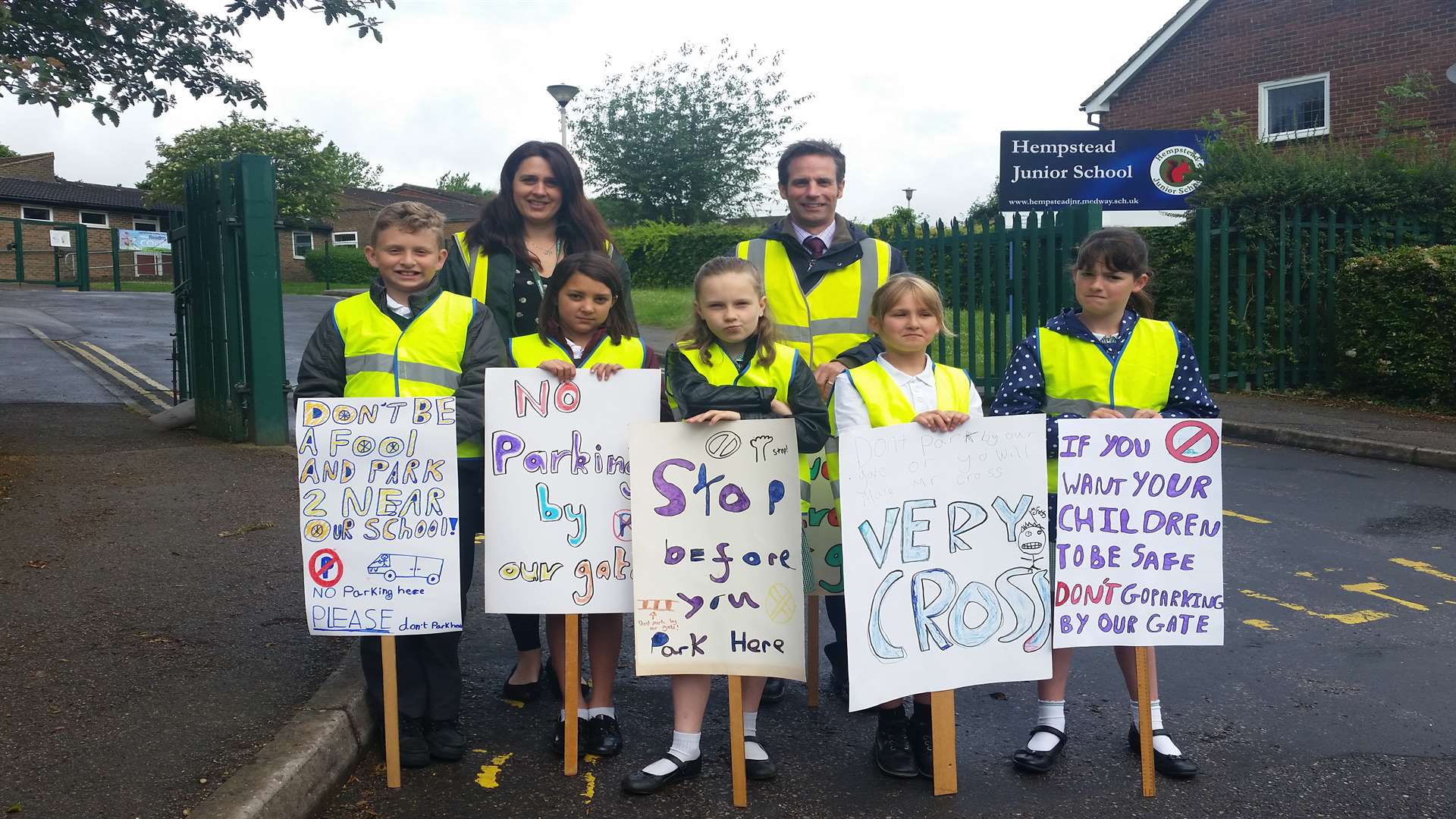 Headteacher Paul Cross and Year 4 teacher Jadi Little with the junior road safety officers