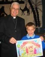 CONGRATULATIONS: Sam with his winning entry and the Rt Rev Stephen Venner