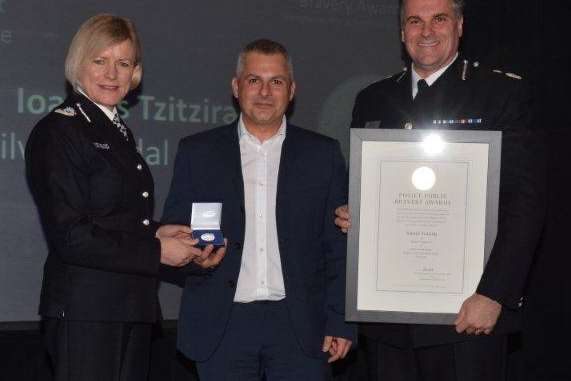 Chair of National Police Chiefs’ Council (NPCC) Sara Thorton (left), and Kent Police Chief Constable Alan Pughsley (right) present Ioannis Tzitziras with the silver award.