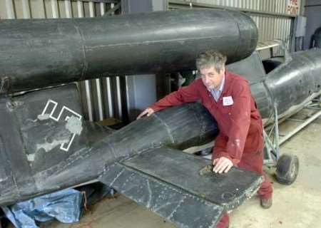 Jamie Freeman of Headcorn Aerodrome with a German flying bomb which is going back to Germany to be restored. Picture: JOHN WARDLEY