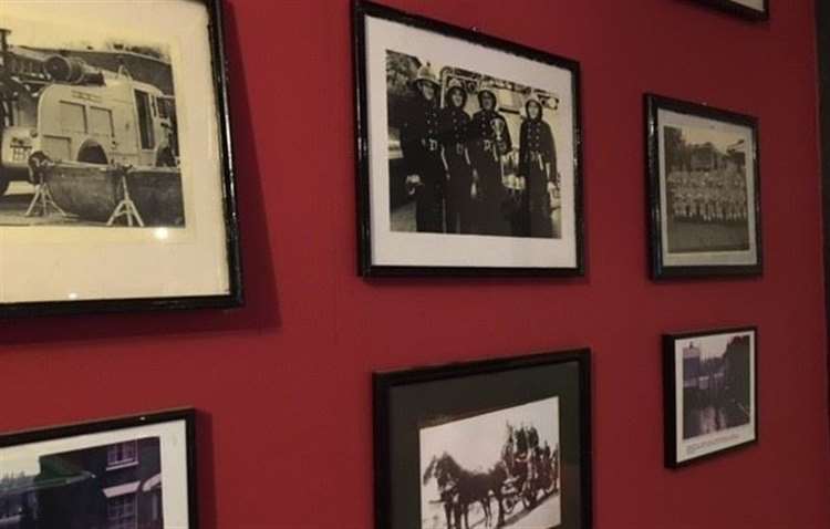 Years ago this room used to house the village fire station and one wall has been devoted to recording the history of the fireman who served here.