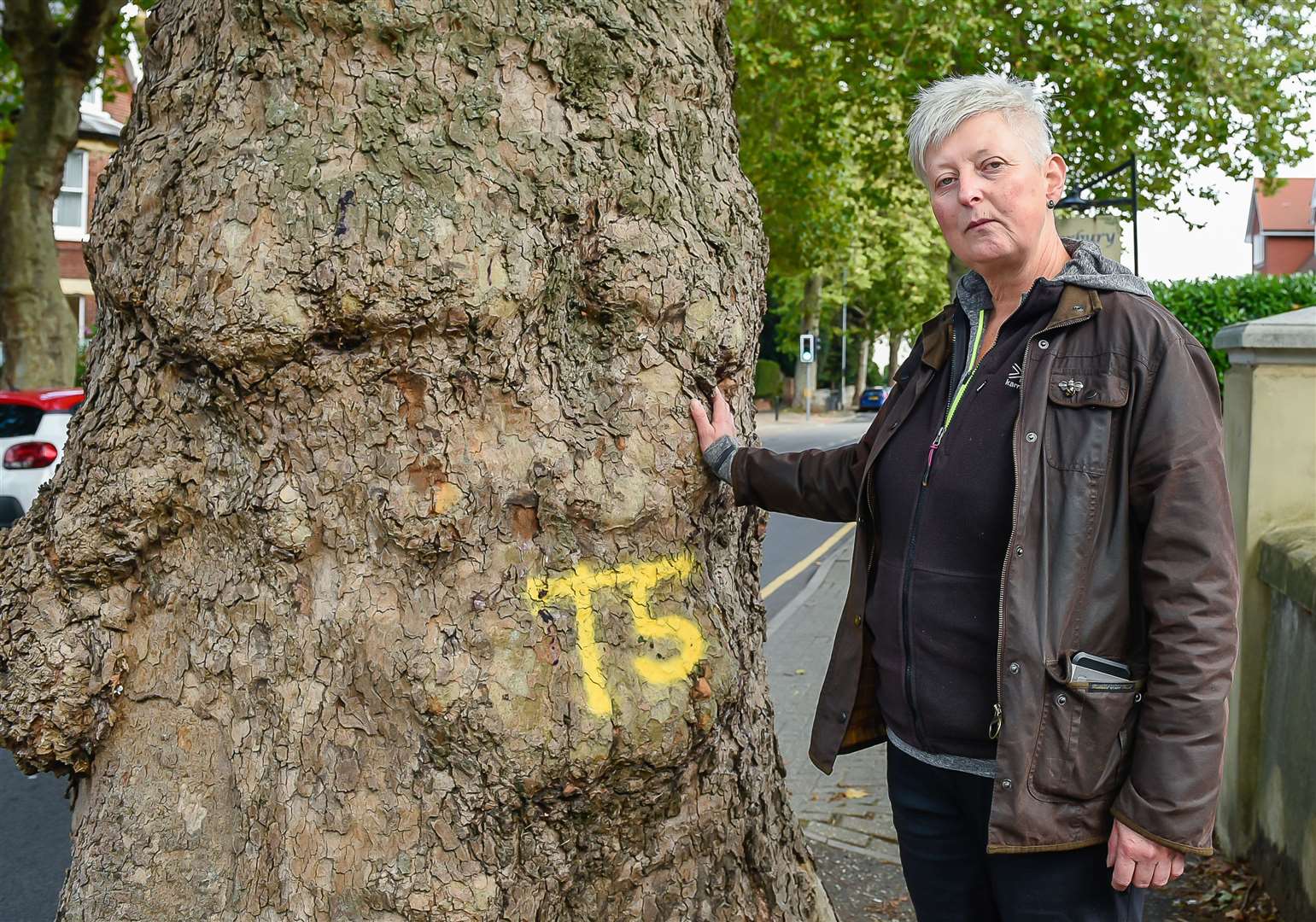 Helen Applegarth with 130-year-old plane tree she is trying to save from being axed