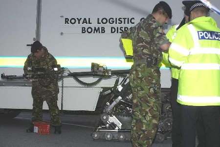The bomb disposal team preparing the remote-controlled "wheelbarrow" to investigate the package. Picture: ANDY PAYTON