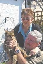 Michael and Shirley Miller with latest cat, Ollie. Picture: Barry Duffield