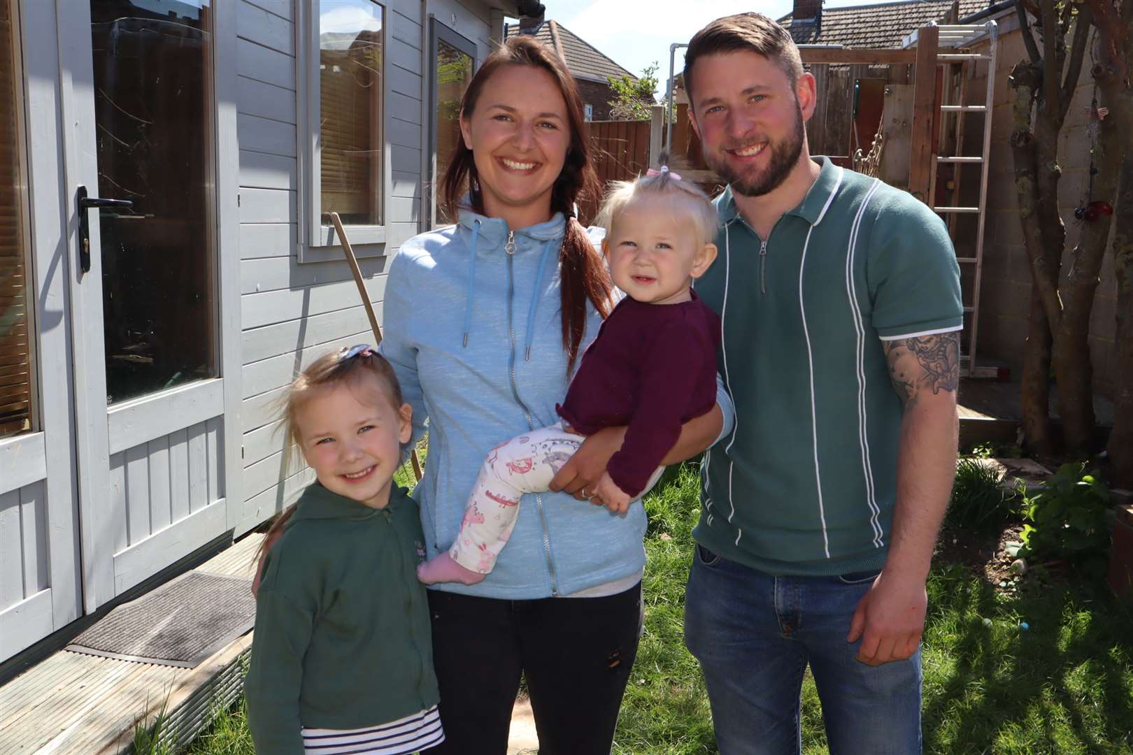 Success: Mum of two Nikki Webster has been given her first Covid jab after a long battle. She's pictured with her partner Danny Webster and daughters Scarlet and Maya at their home in New Road, Minster, Sheppey