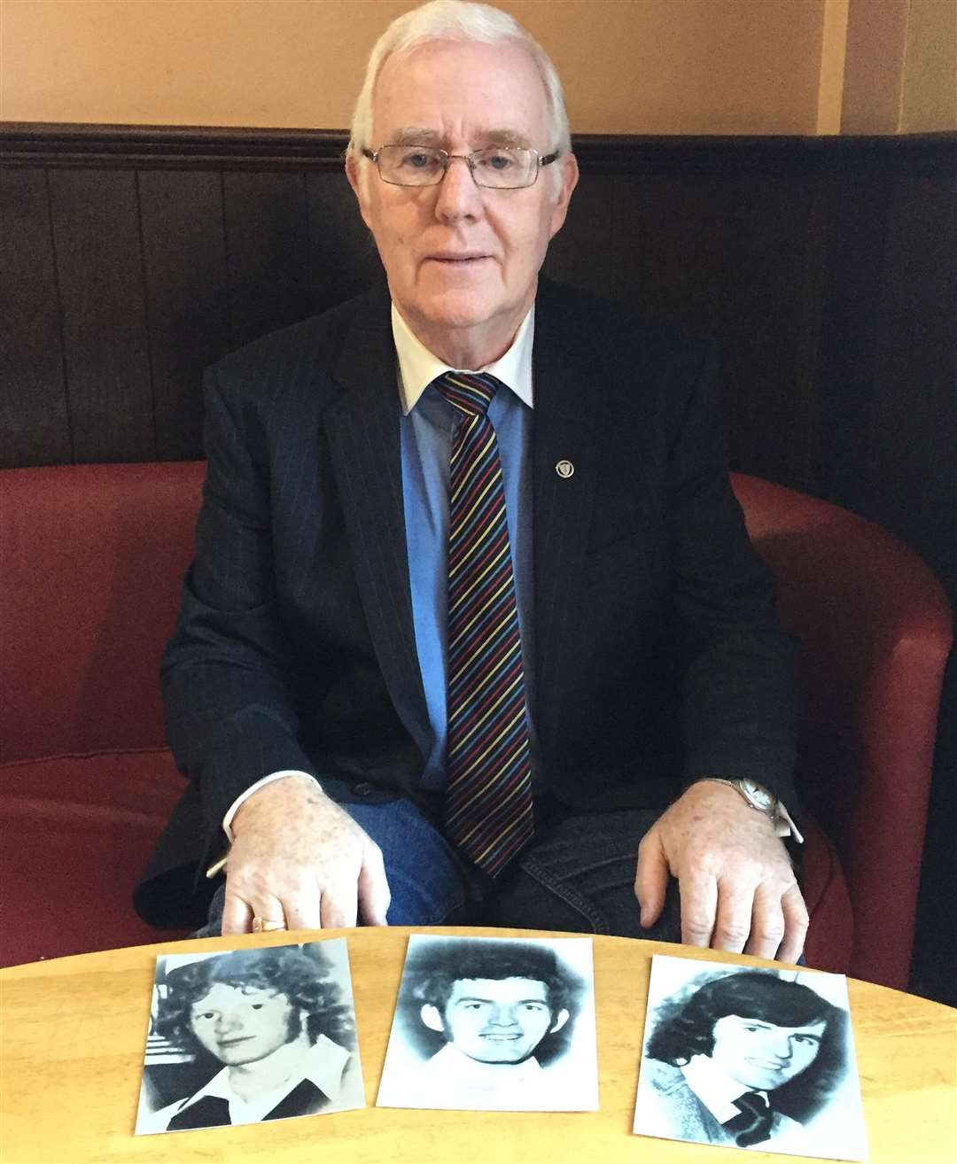 Eugene Reavey with pictures of his brothers (left to right) Anthony, John Martin and Brian, who were killed by a loyalist murder squad in 1976 (PA)