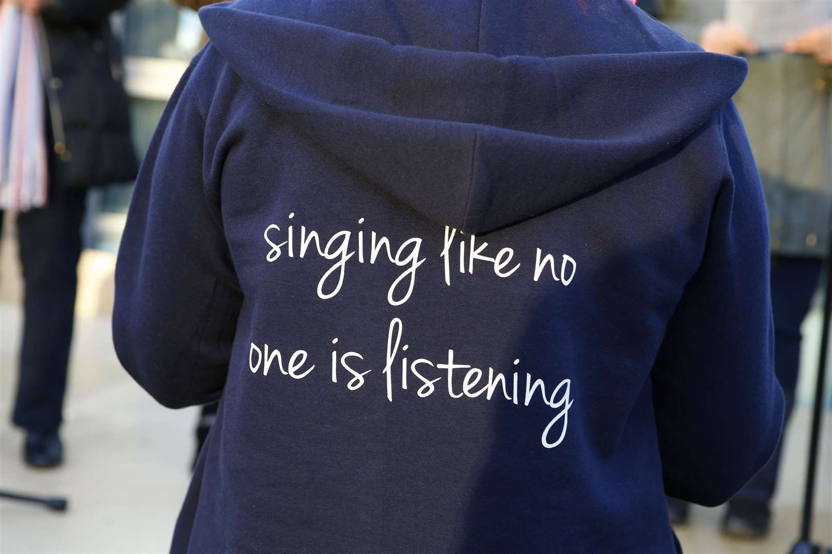 The choir wears its motto with pride