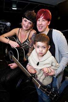 Oliver Smith on stage, with mum Natalie Smith and acoustic blues artist Larnie Jayne