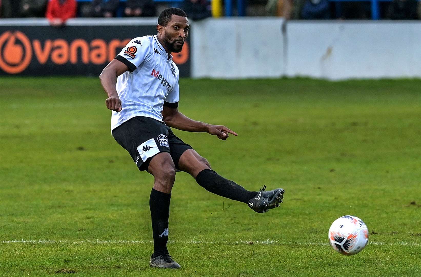 Dover defender Tyrone Sterling passes the ball on. Picture: Stuart Brock
