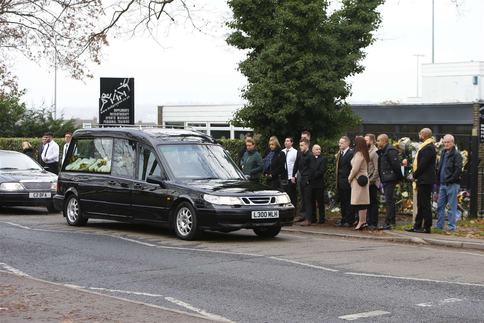 Mourners gather outside the club in Armstong Road