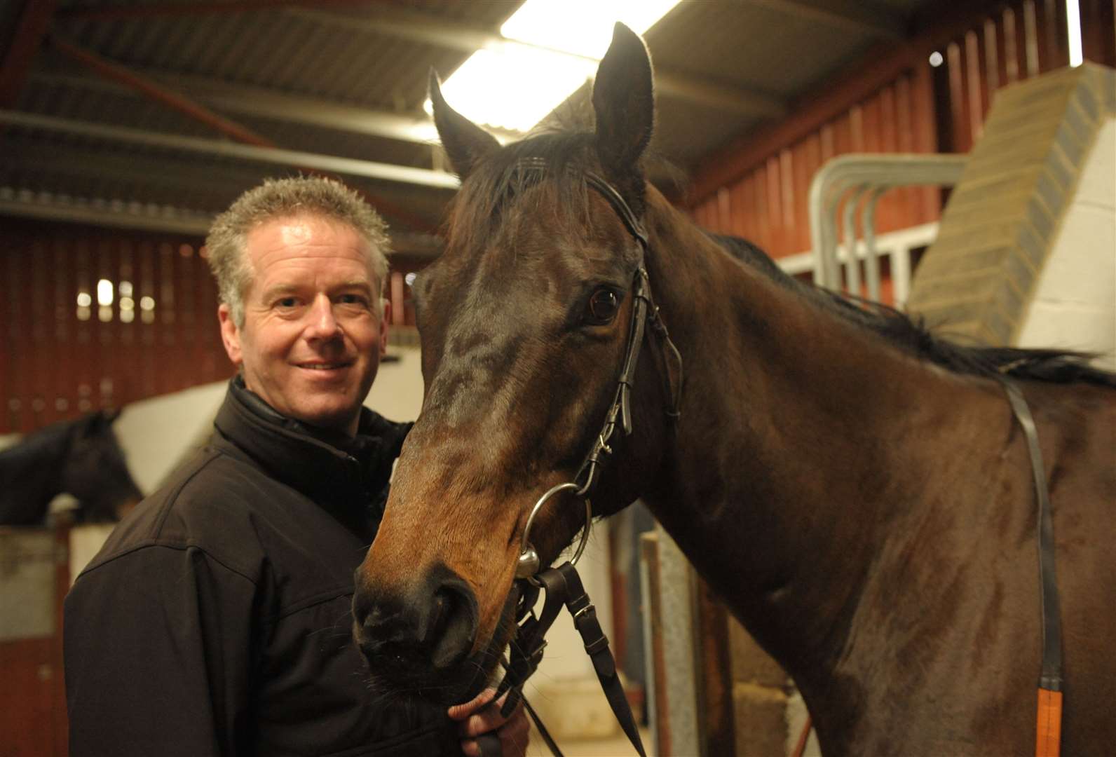 Trainer John Best at Eyehorn Farm with the worlds fastest horse, Stone of Folca. Picture: Steve Crispe